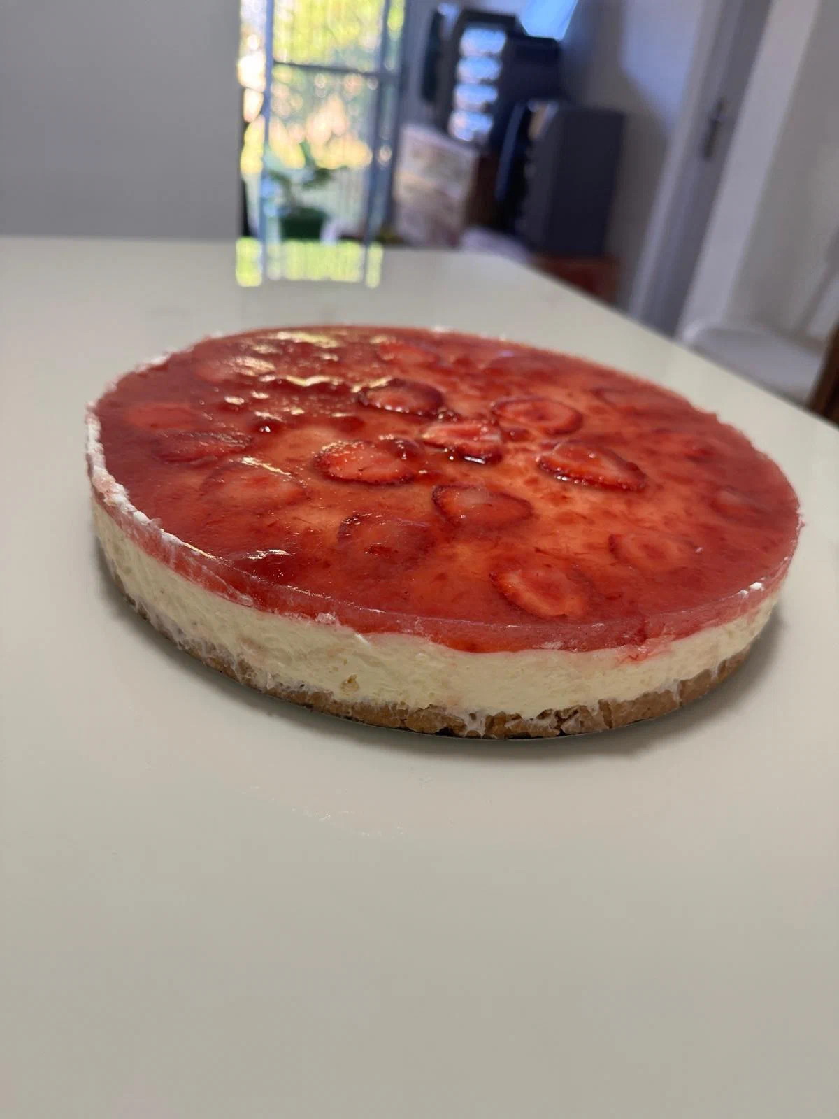 Cheesecake con frutillas y salsa de frutilla